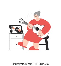 Old lady in red dress learning to play guitar from video lesson on tablet. Trendy vector flat illustration isolated on white background. Active retirement, elderly online education concept. 
