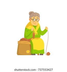Old lady spinning ball of wool