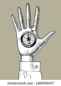 Old magnetic geographic compass on the palm hand. Vintage engraving stylized drawing. Vector Illustration
