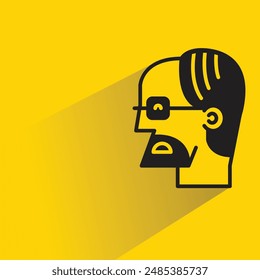 old man face with shadow on yellow background