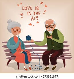  Old man gives the ball of yarn to the old woman, she smiles, eyes closed