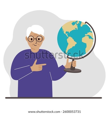 A old man holds a globe in his hand and points his finger at it. The concept of education, teacher, world conquest, ecology.