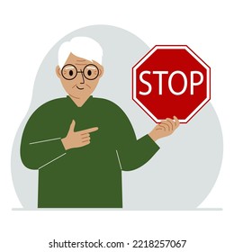 A old man holds a red stop sign in his hand. Vector flat illustration