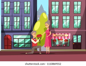 Old man makes marriage proposal standing on knee to old woman. Proposed wedding concept, old couple in love. Man with flowers makes a woman an offer of marriage at street, elder relationship
