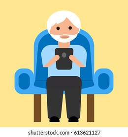 Old man with tablet on armchair