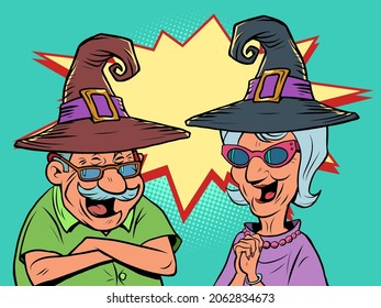 An old man and an old women couple in halloween hats laugh. love and friendship