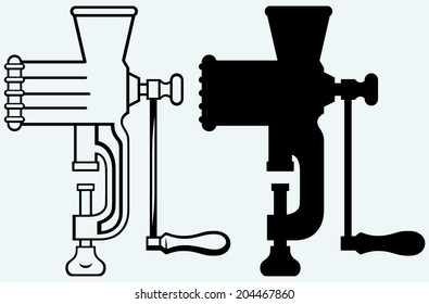 The old manual meat grinder. Image isolated on blue background