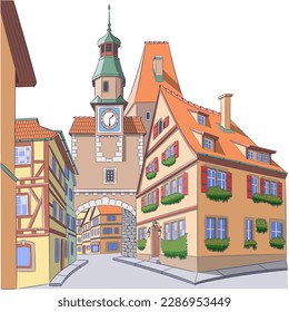 Old medieval street with beautiful houses and clock tower in Rothenburg ob der Tauber.