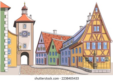 Old medieval street with colorful houses and clock tower in Rothenburg ob der Tauber.