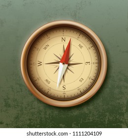 Old metal compass with arrow in retro style. Stock vector illustration.