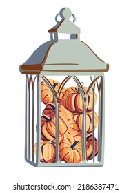 Old metal lamp with small pumpkins inside.