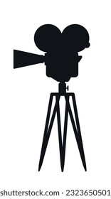 Old movie camera vector icon in black color.