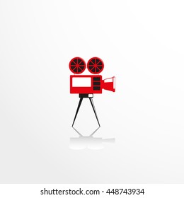 Old movie camera. Vector icon.
