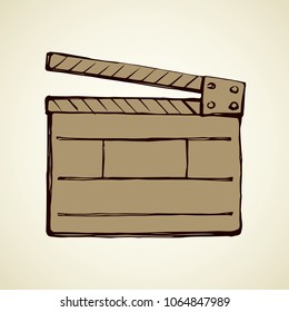 Old open striped start flick take device on white backdrop. Freehand line dark ink hand drawn clapperboard logo pictogram sketchy in artistic vintage doodle style. Closeup view with space for text