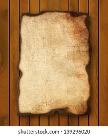 Old  paper with burnt edges isolated on a wooden background. Vector  eps10