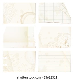 Old paper sheets - checked, lined, stained, decorated with ornaments - isolated on white background