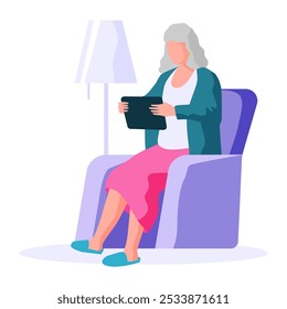 Old people. A senior woman with gray hair sits comfortably in an armchair, using a tablet, with a floor lamp next to her. Ideal for retirement, technology for seniors, relaxation, leisure activities