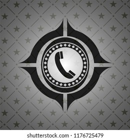 old phone icon inside black emblem