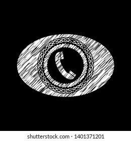 old phone icon inside chalk emblem written on a blackboard