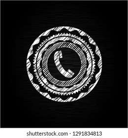 old phone icon inside chalkboard emblem on black board