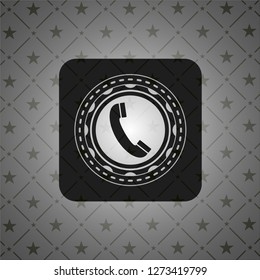 old phone icon inside dark emblem
