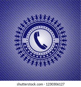 old phone icon inside denim background