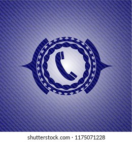 old phone icon inside emblem with jean texture