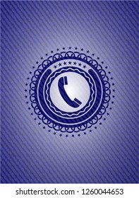 old phone icon inside emblem with denim texture