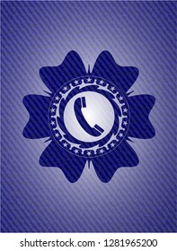 old phone icon inside emblem with jean texture