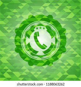 old phone icon inside green mosaic emblem