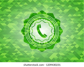 old phone icon inside green emblem with triangle mosaic background