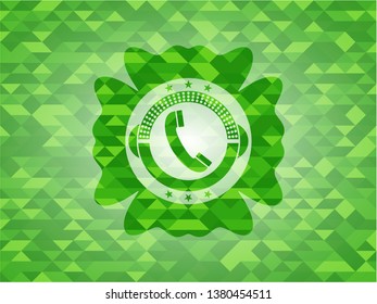 old phone icon inside green emblem with mosaic background