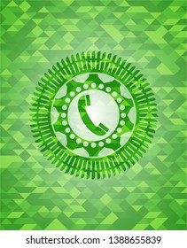 old phone icon inside green emblem with mosaic ecological style background