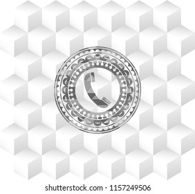 old phone icon inside grey emblem with cube white background