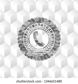 old phone icon inside grey emblem with geometric cube white background