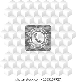 old phone icon inside grey badge with geometric cube white background