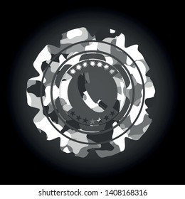 old phone icon inside grey camouflage emblem