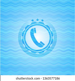 old phone icon inside light blue water emblem.