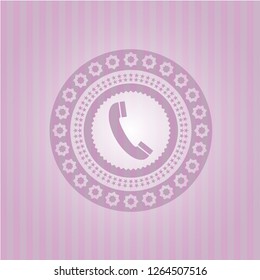 old phone icon inside pink emblem