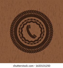 old phone icon inside realistic wood emblem
