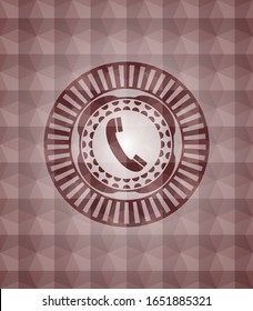 old phone icon inside red seamless emblem or badge with abstract geometric polygonal pattern background.