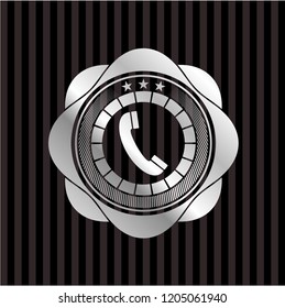 old phone icon inside silver badge or emblem