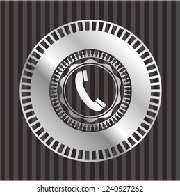 old phone icon inside silver emblem or badge