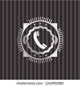 old phone icon inside silver badge or emblem