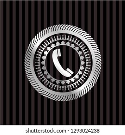 old phone icon inside silver badge