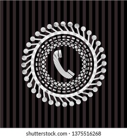 old phone icon inside silvery emblem