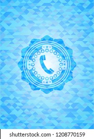 old phone icon inside sky blue mosaic emblem