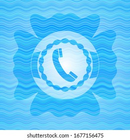old phone icon inside sky blue water wave badge.