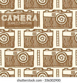 Old photo camera seamless pattern. Vintage style, hand drawn pen and ink.  Vector seamless pattern for wrapping. Retro design element for electronics store packaging