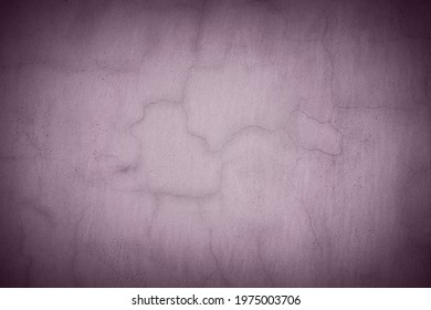 Old purple wall in spots, cracks, stains. Grey painted concrete wall in abstract grunge style. Grunge loft background texture for backgrounds, portraits, posters.